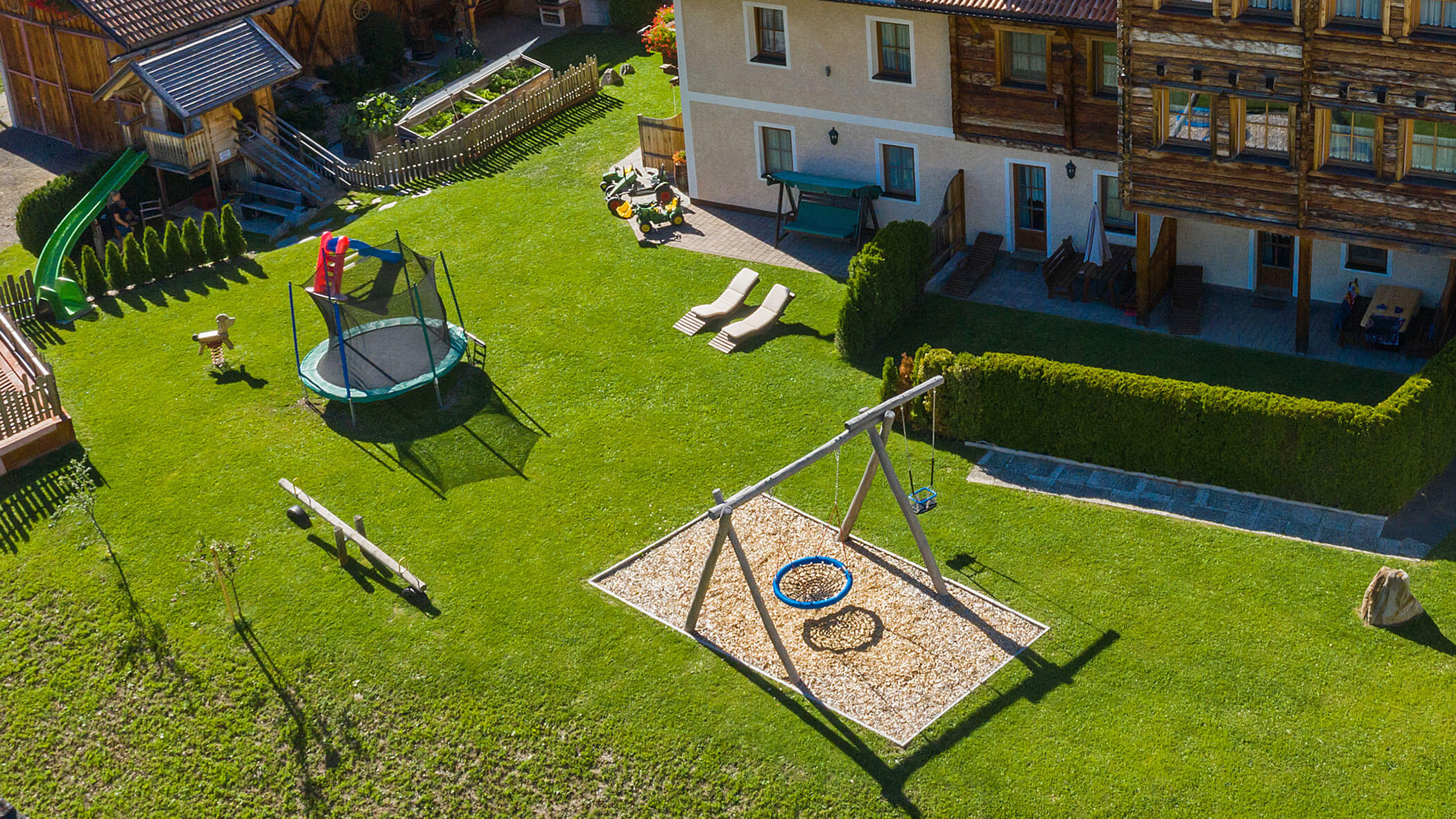 The Hirschenhof from the outside with large garden and small playground